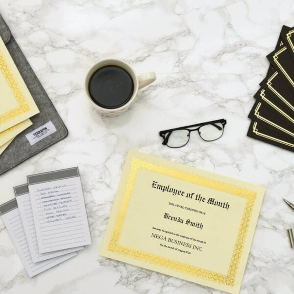 Employee of the Month certificate displayed on a desk